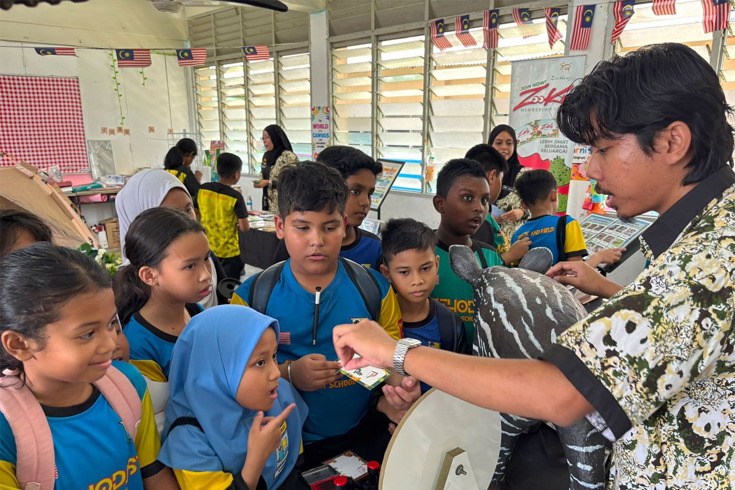 Children learning about wildlife during an educational activity at Zoo Negara Malaysia